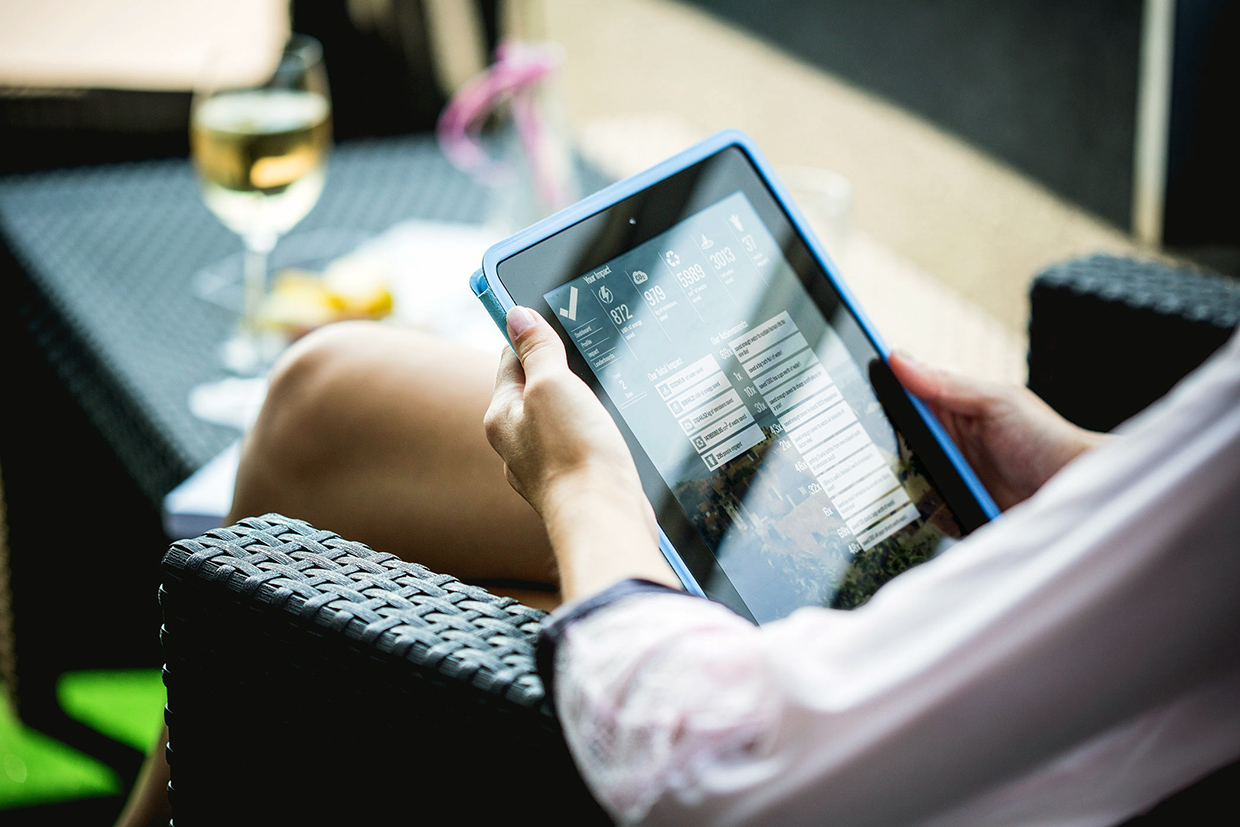 Photo of a person in chair using Effectify on a tablet